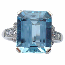 oval emerald cluster rub over diamonds claw set emerald seconhand preowned preloved delicute ring 18ct yellow white gold